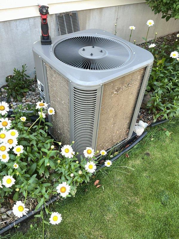 Completed comprehensive ComfortGuard Maintenance Package including full system inspection of outdoor condenser unit. Replaced air filter and evaporative cooler pad as requested, performed standard 5-year recurring maintenance protocol including cleaning of condenser coils, verification of refrigerant levels, electrical connection inspection, and operational testing of all components to ensure optimal system performance.