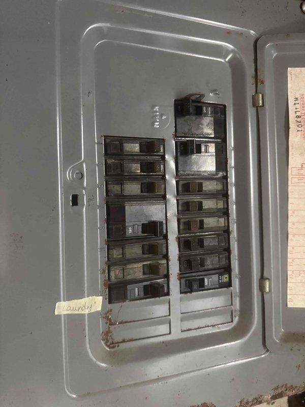 Conducted full system estimate for central air conditioning replacement in 990 square foot single-story residence with 15-year-old existing AC unit. Assessed electrical panel capacity and existing breaker configuration in preparation for new system installation, noting panel age and condition. Evaluated basement mechanical space, including current furnace location, ductwork routing, and available clearances for new equipment placement.