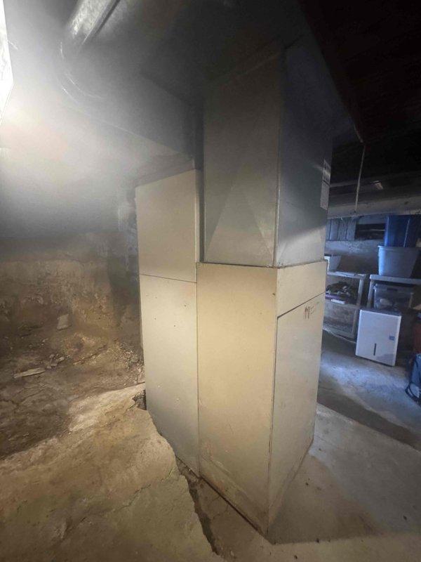 Conducted full system estimate for central air conditioning replacement in 990 square foot single-story residence with 15-year-old existing AC unit. Assessed electrical panel capacity and existing breaker configuration in preparation for new system installation, noting panel age and condition. Evaluated basement mechanical space, including current furnace location, ductwork routing, and available clearances for new equipment placement.