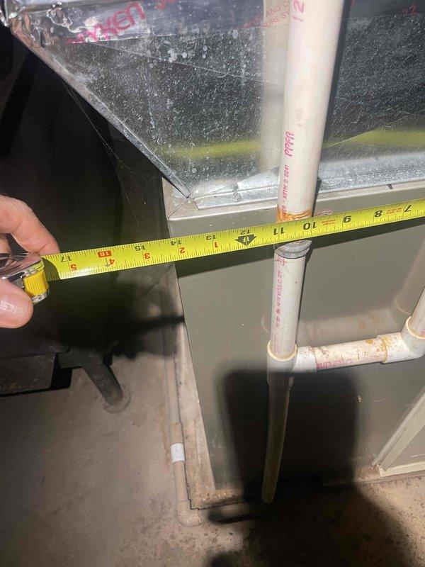 Conducted on-site evaluation for complete air conditioning system replacement. Existing outdoor condensing unit is approximately 37 years old and has reached end of serviceable life. Inspected electrical panel to verify existing circuit breaker configuration and amperage ratings for AC system, documented current 30-amp breaker setup. Measured existing air handler dimensions and clearances to determine equipment specifications for replacement unit. Assessed PVC condensate drain line routing and condition. Photographed electrical panel labeling and existing equipment measurements for accurate replacement sizing and installation planning. Provided estimate for complete system replacement with installation timeline of 2-3 weeks per owner's request.