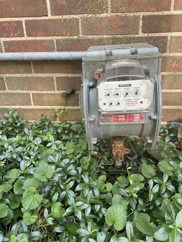 Conducted comprehensive site assessment for whole-home standby generator installation at 80-year-old residential property. Evaluated existing electrical service capacity, documented current gas meter location and condition on exterior brick wall, and assessed optimal placement for generator unit considering clearance requirements from structure, windows, and utility connections. Photographed exterior wall conditions, existing utility infrastructure, and potential installation areas to develop accurate equipment specifications and installation proposal for customer review.