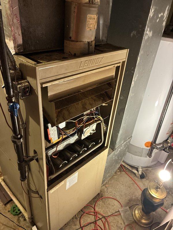 Provided estimate for furnace replacement in basement. Current 40+ year old Lennox unit is non-operational and requires complete replacement due to age and failure of critical components. Assessed existing ductwork configuration and clearances for new equipment installation.