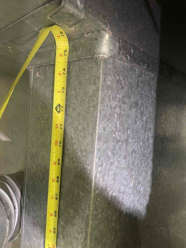 Performed comprehensive site evaluation and measurement documentation for replacement estimate of 36-year-old air conditioning outdoor unit. Assessed existing ductwork dimensions and system configuration, capturing detailed measurements of supply and return ducts to ensure proper sizing for new equipment installation. Documented current HVAC infrastructure including galvanized metal ductwork and connection points. Provided replacement recommendations and estimate for complete outdoor condensing unit replacement to restore reliable cooling capacity to the residence.