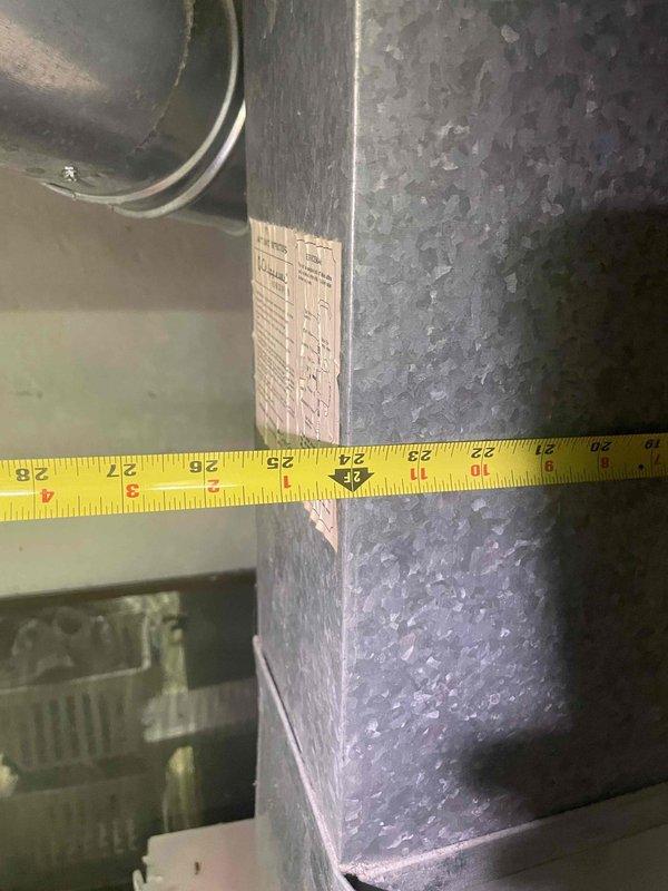 Performed comprehensive site evaluation and measurement documentation for replacement estimate of 36-year-old air conditioning outdoor unit. Assessed existing ductwork dimensions and system configuration, capturing detailed measurements of supply and return ducts to ensure proper sizing for new equipment installation. Documented current HVAC infrastructure including galvanized metal ductwork and connection points. Provided replacement recommendations and estimate for complete outdoor condensing unit replacement to restore reliable cooling capacity to the residence.