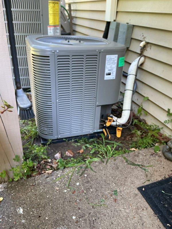 Performed comprehensive AC tune-up and furnace maintenance on 4-year-old Lennox system. Inspected indoor air handler unit with condensate pump assembly and verified proper drainage through PVC condensate lines. Evaluated outdoor condenser unit, checked refrigerant lines and electrical connections, and cleared vegetation growth from around unit base and concrete pad. Confirmed system operating properly and provided air filter to customer as requested.