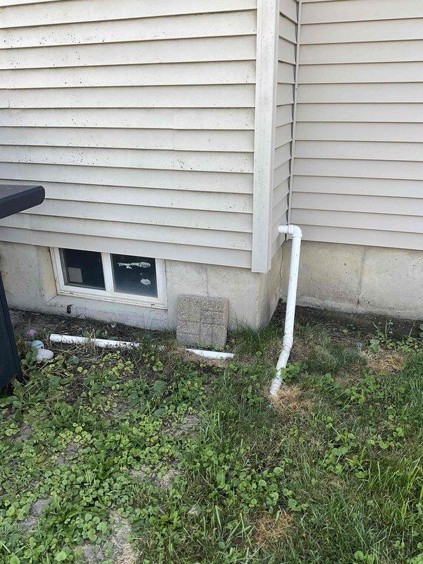 Performed comprehensive evaluation of existing HVAC system for full replacement estimate. Both air conditioning unit and furnace have reached approximately 20 years of service life and require replacement. Assessed basement-installed furnace with existing copper ductwork configuration and overhead distribution system. Evaluated exterior condensing unit location and foundation clearances. Documented current equipment specifications, mechanical room layout with confined access corridor, existing duct routing, and outdoor unit placement for proper system sizing and installation planning.