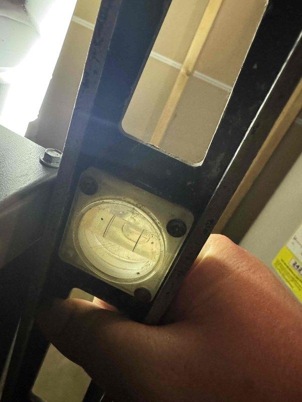 Responded to no cooling complaint on six-month-old air conditioning system. Upon arrival, performed diagnostic assessment of outdoor unit and checked system operation. Utilized measurement instrumentation to verify unit levelness and proper installation, as improper positioning can affect refrigerant flow and compressor performance in newer equipment. Found unit required leveling adjustment to ensure optimal operation and prevent future compressor issues. Corrected installation deficiency and verified system returned to normal cooling operation.