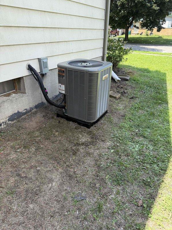 Completed full HVAC system installation including new outdoor condensing unit and indoor evaporator coil. Installed condenser on existing concrete pad with proper refrigerant line sets, electrical disconnect, and conduit penetration through exterior wall. Connected new evaporator coil to existing ductwork with flexible metal transition duct. All permits were requested prior to installation, and financing paperwork with identification documentation was completed and signed.
