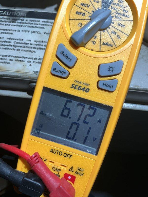 Performed comprehensive tune-up on 55+ year old outdoor HVAC unit. Conducted electrical diagnostics using digital multimeter, measuring amperage at 6.72A and voltage readings, and inspected heat exchanger coils for proper operation. All components tested within acceptable parameters and unit returned to normal operating condition.