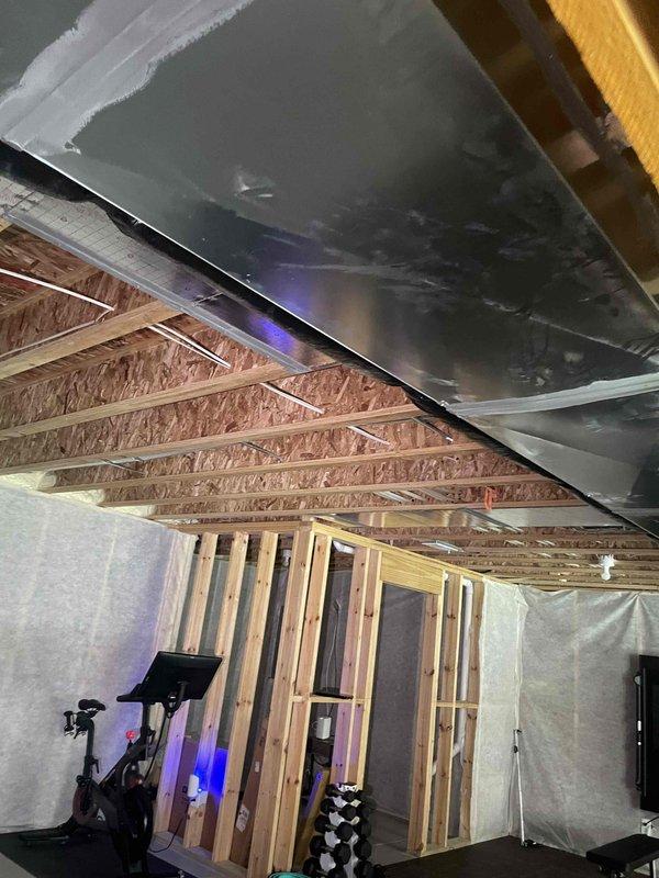 Completed on-site evaluation for backup generator installation at new home construction. Assessed electrical infrastructure requirements for Kohler generator system integration. Documented existing electrical panel location, available service capacity, and optimal generator placement options. Evaluated transfer switch installation requirements and determined necessary load calculations for whole-house backup power configuration. Photographed unfinished interior spaces showing exposed ceiling joists, OSB sheathing, existing HVAC ductwork routing, and wall framing to identify potential conduit pathways and equipment mounting locations. Reviewed structural considerations for exterior generator pad placement and fuel line routing. Prepared comprehensive estimate for complete automatic standby generator system installation including transfer switch, electrical connections, and code-compliant integration with existing service.
