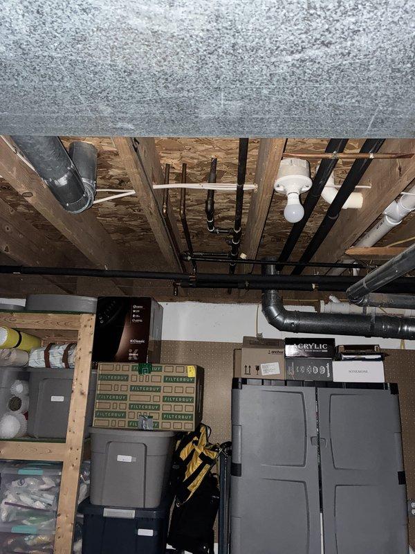 Conducted on-site assessment for whole house Generac generator installation at 30-year-old condominium unit with condo board approval. Evaluated basement mechanical room containing existing HVAC furnace, water heater, electrical panel, and associated ductwork to determine optimal generator placement and electrical integration requirements. Documented existing infrastructure including circuit breaker panel configuration, PVC condensate drainage systems, and available utility space for transfer switch installation. Photographed mechanical room layout, overhead joist structure with exposed utilities, and current electrical service capacity to develop comprehensive installation estimate. Identified routing pathways for generator feed cables and assessed ventilation requirements for code-compliant installation.