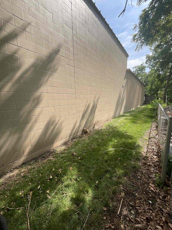 Conducted on-site estimate for mini-split installation in newly constructed shop space. Assessed exterior wall construction and identified suitable mounting location on cinder block wall for outdoor condenser unit. Documented existing moisture intrusion and mold damage in interior wall cavity near proposed installation area, which will require remediation prior to completing mini-split system installation.