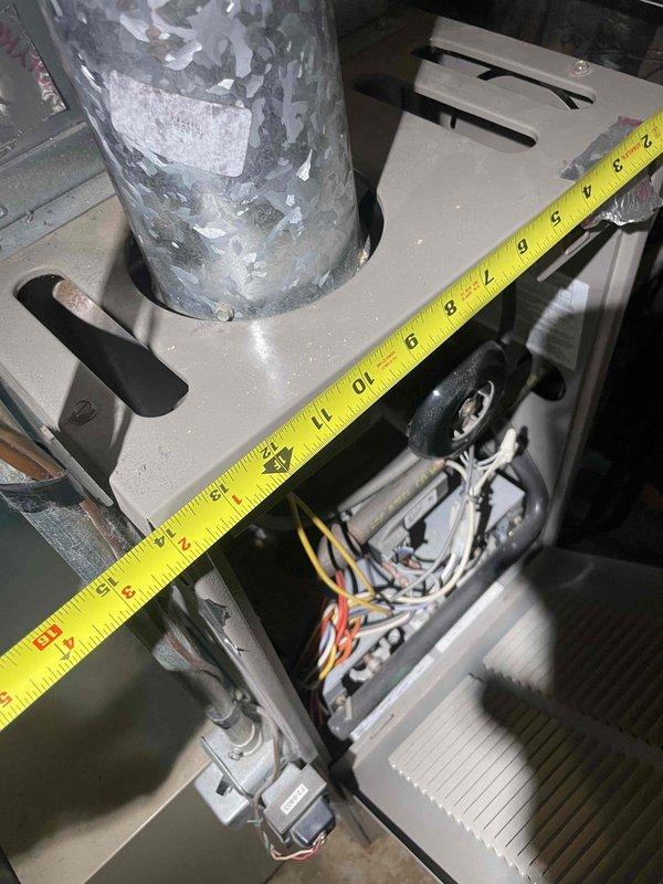 Conducted comprehensive assessment of aging HVAC system in basement of tri-level residence for complete air conditioning and furnace replacement estimate. Evaluated existing equipment showing signs of deterioration including corroded ductwork and degraded galvanized piping, with current system experiencing intermittent operational issues. Documented equipment dimensions, clearances, and existing infrastructure including electrical connections, copper refrigerant lines, and duct configuration to determine optimal replacement specifications for new heating and cooling system installation.