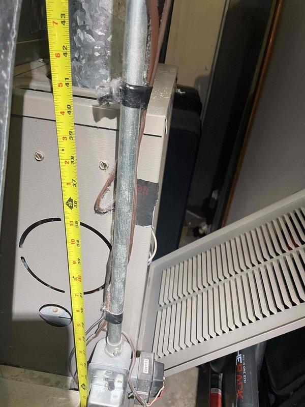 Conducted comprehensive assessment of aging HVAC system in basement of tri-level residence for complete air conditioning and furnace replacement estimate. Evaluated existing equipment showing signs of deterioration including corroded ductwork and degraded galvanized piping, with current system experiencing intermittent operational issues. Documented equipment dimensions, clearances, and existing infrastructure including electrical connections, copper refrigerant lines, and duct configuration to determine optimal replacement specifications for new heating and cooling system installation.