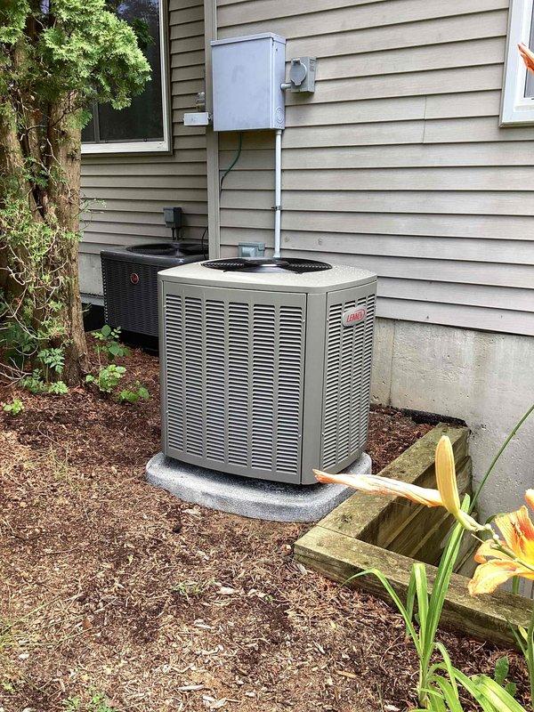 Completed full HVAC system installation including a 70,000 BTU furnace with rear return configuration, 2-ton air conditioning unit, and whole-home humidifier. Unit positioned on concrete pad with proper electrical conduit installation, disconnect box mounting, and all refrigerant line connections completed per manufacturer specifications. All mechanical and electrical permits obtained, system tested and operational upon departure.