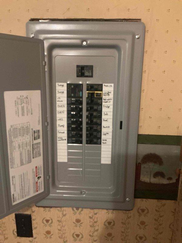 Coordinated utility disconnect and reconnect services with power company for electrical panel upgrade and transfer switch installation. Installed Kohler transfer switch with proper conduit runs and metering equipment on exterior wall, ensuring all components met code requirements for State of Michigan inspection. Successfully completed installation with inspector approval before utility reconnection, verifying all circuits properly labeled and operational in main distribution panel.