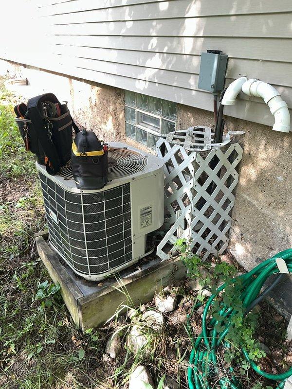 Responded to no cooling complaint with intermittent screeching noise from outdoor condensing unit. Upon arrival, performed visual inspection of AC system and identified accessible components. Unit appeared to be older model with weathered exterior casing and debris accumulation around base on concrete pad. Documented current condition of equipment and surrounding area including vegetation growth and drainage concerns near foundation. Unable to complete full diagnostic assessment or identify specific mechanical failure causing screeching noise and loss of cooling capacity during this visit. Recommend follow-up service call for comprehensive system evaluation including refrigerant pressure testing, compressor operation analysis, and condenser fan motor inspection to determine root cause of reported symptoms.
