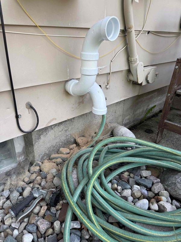 Completed full HVAC system installation including a 70,000 BTU furnace, 2-ton air conditioning unit with evaporator coil, and humidifier in basement mechanical room. Installed exterior condensing unit in rear yard with proper refrigerant line set and electrical connections. Configured PVC condensate drainage system along exterior wall, reconnected all ductwork to new equipment, and verified proper system operation. All work performed under mechanical permit with equipment properly mounted, leveled, and secured per manufacturer specifications.