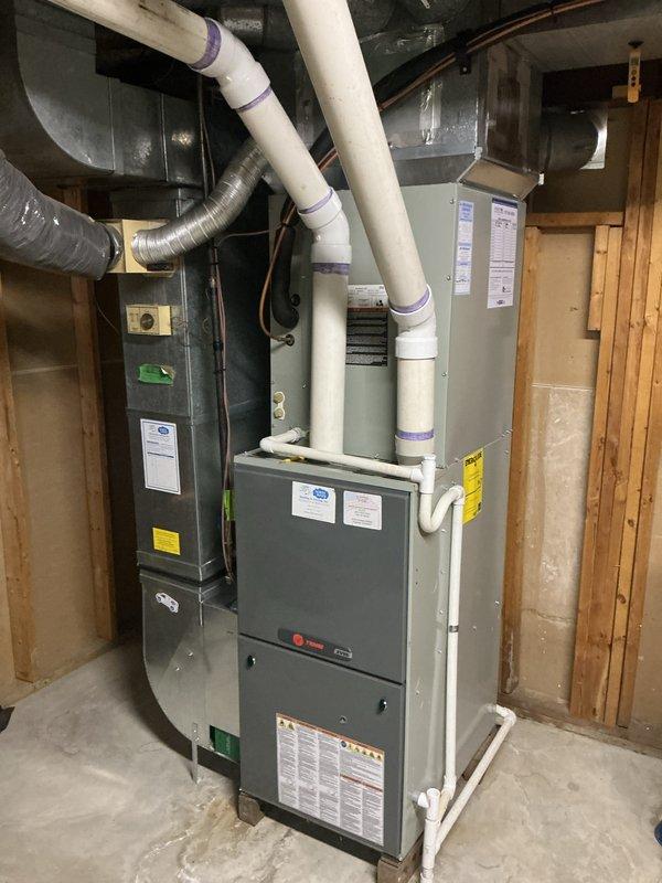 Completed annual cooling maintenance on residential HVAC system including Trane furnace with air handler and outdoor condenser unit. Performed comprehensive inspection of indoor and outdoor equipment, checked refrigerant levels, cleaned condenser coils, verified proper airflow through louvers, inspected condensate drain lines and PVC venting, tested electrical connections, and confirmed system operation within manufacturer specifications.