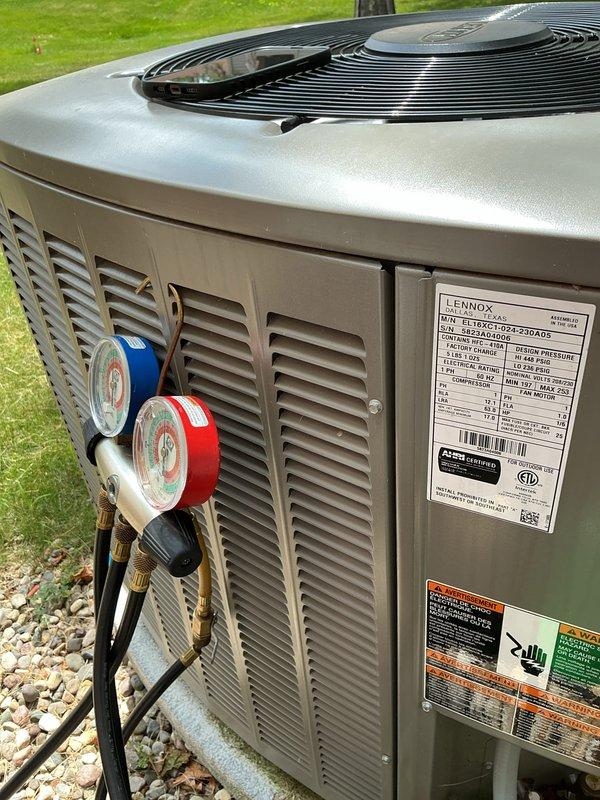 Completed second annual maintenance visit on Lennox furnace and air conditioning system. Performed standard maintenance checklist including filter replacement and evaporator coil inspection at indoor unit. Connected manifold gauges to outdoor condenser unit to verify refrigerant pressures and system performance. All components operating within normal parameters with no issues identified during inspection.