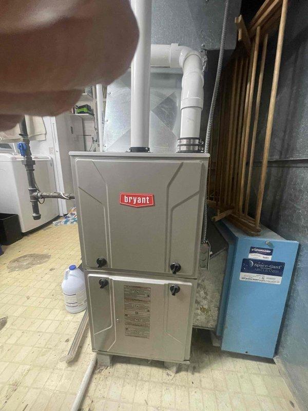 Conducted on-site evaluation for mini split heat pump installation. Assessed existing electrical infrastructure, including 100A Bryant load center with available circuit capacity and sub-panel connections. Inspected current HVAC system consisting of Bryant furnace unit in basement mechanical room. Documented electrical panel configuration, available breaker positions, and wiring pathways to determine optimal installation routing for new mini split system. Photographed equipment locations and utility room layout to develop installation plan and equipment placement recommendations for heat pump outdoor condenser and indoor air handling units.