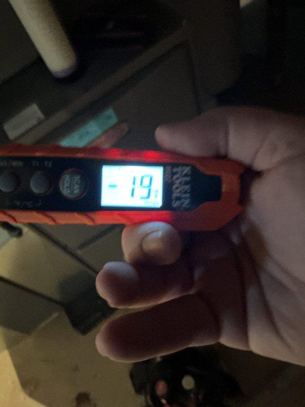 Responded to service call for newly installed AC system experiencing water leakage and reduced cooling capacity. Upon arrival, performed diagnostic evaluation of outdoor condenser unit and system operation. Removed top fan grille to access and inspect condenser fan assembly and internal components. Conducted pressure and temperature measurements using digital diagnostic equipment, which revealed a suction line reading of -19, indicating potential refrigerant flow issues or low charge condition. Inspected drain line system and condensate removal components to identify source of water leak. Evaluated overall system performance and documented findings with photographic evidence of equipment condition and diagnostic readings. System assessed for potential installation defects or component failures given unit's age and history of repeated service issues. Recommended follow-up actions to address underlying cause of recurring problems with this new installation.