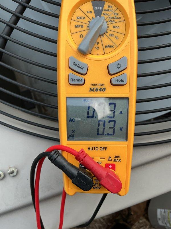 Performed annual cooling maintenance on residential air conditioning system. Using digital multimeter, measured and recorded condenser fan motor amperage and voltage readings to verify proper operation within manufacturer specifications. All electrical components tested and found operating normally. Unit running efficiently with no issues identified during inspection.