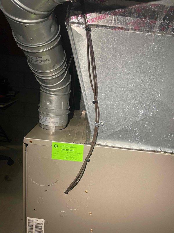 Provided estimate for replacement of approximately 15-year-old air conditioning system located in basement, currently non-operational due to suspected refrigerant leak and equipment age making repair uneconomical. Assessed existing setup including gas furnace, ductwork showing significant condensation, and current system configuration with condensate drainage components. Documented equipment condition and discussed replacement options for complete air conditioning system compatible with existing natural gas heating infrastructure.