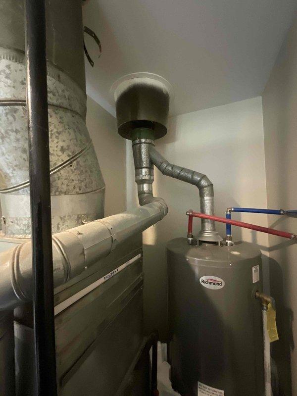 Completed on-site evaluation for full HVAC system replacement, including 21-year-old air conditioning condenser unit located on exterior and 25-year-old furnace in basement. Documented existing equipment configuration with exterior condenser showing standard electrical disconnect and typical residential installation, and basement furnace alongside Richmond water heater in mechanical room. Provided comprehensive replacement quote for complete heating and cooling system upgrade with recommended equipment options and installation timeline to accommodate customer's one-month replacement window.
