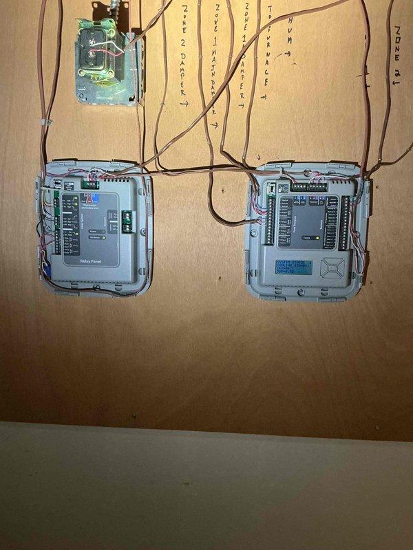 Responded to no cooling complaint where homeowner reported excessive cooling and continuous system operation. Upon arrival, verified thermostat operation using calibrated digital thermometer, confirming accurate temperature reading of 74°F matching setpoint. Inspected modern touchscreen thermostat showing proper communication with system, displaying correct zone temperature, outdoor conditions, and humidity levels. Examined multi-zone control relay panels and associated wiring connections in mechanical room, finding all components functioning as designed. Determined unit was operating normally per thermostat demand with no equipment malfunction present. Educated homeowner on proper thermostat operation and advised against closing registers as this restricts airflow and can cause system issues. Recommended keeping all supply registers open for proper system balance and air distribution throughout home.