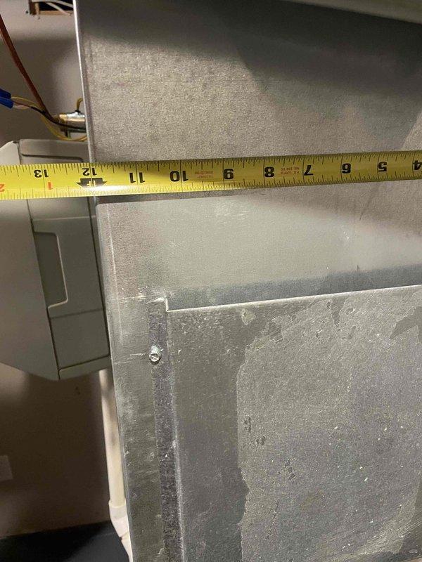 Conducted comprehensive full system estimate for 16-year-old air conditioning and furnace system requiring immediate replacement. Performed detailed measurements and photographic documentation of existing HVAC equipment, ductwork dimensions, and condensate drainage system. Assessed equipment condition noting moisture staining and mineral deposits on unit panels indicating long-term condensation exposure, evaluated duct sizing and configuration, and documented current mechanical room layout to provide accurate replacement system specifications and installation requirements.