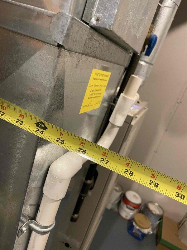 Conducted comprehensive full system estimate for 16-year-old air conditioning and furnace system requiring immediate replacement. Performed detailed measurements and photographic documentation of existing HVAC equipment, ductwork dimensions, and condensate drainage system. Assessed equipment condition noting moisture staining and mineral deposits on unit panels indicating long-term condensation exposure, evaluated duct sizing and configuration, and documented current mechanical room layout to provide accurate replacement system specifications and installation requirements.