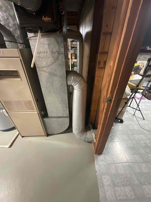 Conducted comprehensive full system estimate for replacement of 16-year-old air conditioning unit that experienced complete failure. Assessed existing HVAC infrastructure in basement utility area, including furnace, ductwork configuration, and air handler components. Documented current system layout with photographic evidence showing galvanized sheet metal ductwork, round metallic supply ducts, and equipment placement to provide accurate replacement specifications for immediate installation needs.