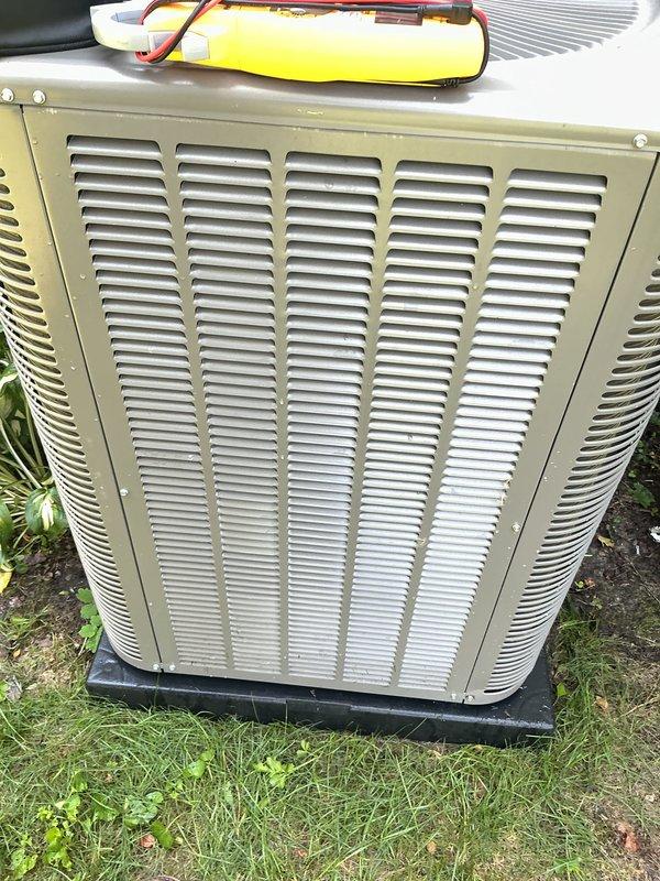 Completed annual preventive maintenance on residential air conditioning system. Performed comprehensive inspection of outdoor condenser unit, including visual assessment of cabinet condition, louvers, and mounting pad. Tested electrical components with multimeter, inspected capacitor connections and wiring integrity. Unit found to be operating within normal parameters with no immediate service needs identified. All components functioning properly at time of service.