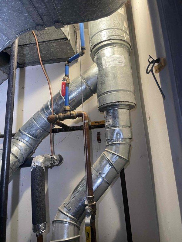 Conducted comprehensive assessment of existing 40-year-old air conditioning system for replacement quote. Evaluated whole-home HVAC infrastructure including outdoor condensing unit, indoor air handler, and distribution ductwork. Documented supply register dimensions and photographed existing duct configuration, copper refrigerant lines, and mechanical connections to provide accurate replacement specifications and ensure proper system sizing for new equipment installation.