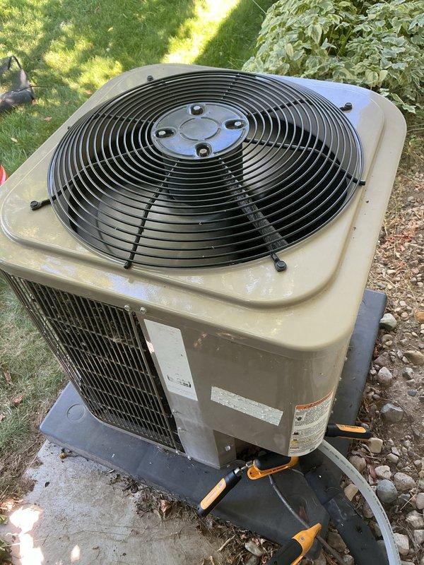 Performed routine air conditioning maintenance and tune-up on residential condenser unit. Inspected outdoor equipment, verified proper operation of compressor and condenser fan, checked refrigerant line connections, and ensured electrical disconnect box functionality. Unit found in operational condition with normal wear consistent with age and outdoor exposure.