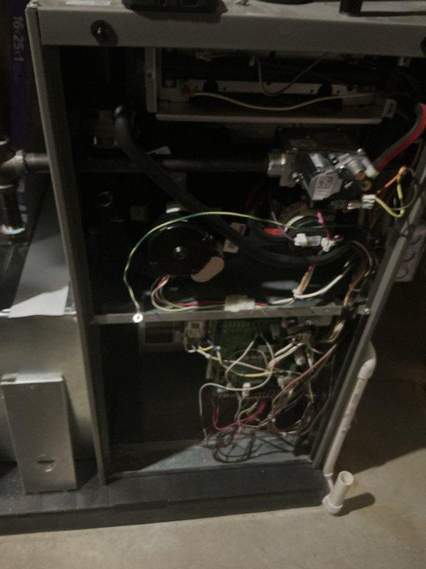 Completed comprehensive 5-year ComfortGuard maintenance visit on residential furnace system. Performed thorough inspection of all internal components including gas valve assembly, pressure switches, blower compartment, and control board. Verified proper wire connections and harness routing throughout cabinet, checked all safety controls and sensors for proper operation. Inspected heat exchanger compartment, cleaned accessible components, and confirmed adequate ventilation through PVC vent piping. All mechanical and electrical systems tested and found operating within manufacturer specifications.