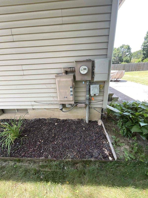 Conducted site assessment for Kohler generator installation estimate at residential property. Evaluated existing electrical service panel, meter location, and available mounting space on exterior wall near utility boxes. Documented current electrical infrastructure including conduit routing options and determined optimal generator placement considering clearance requirements from existing HVAC condenser unit and accessibility for future maintenance.