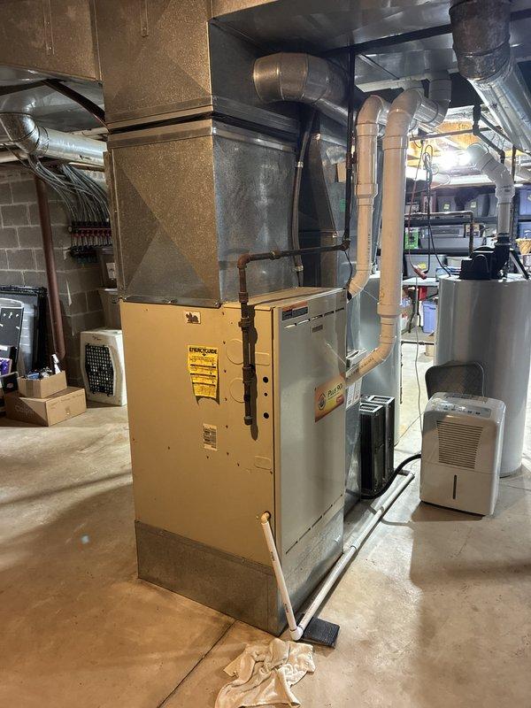 Conducted on-site evaluation for replacement of 20-year-old residential air conditioning system. Assessed existing HVAC infrastructure in basement mechanical room, including furnace, ductwork configuration, and electrical service panel to determine compatibility for new 3.5 to 4-ton AC unit installation. Documented current equipment layout, electrical capacity, and existing condensate drainage routing. Reviewed outdoor condenser unit condition and confirmed system sizing requirements based on home's cooling load. Provided comprehensive replacement estimate with equipment options for installation within the requested 1-2 month timeframe.