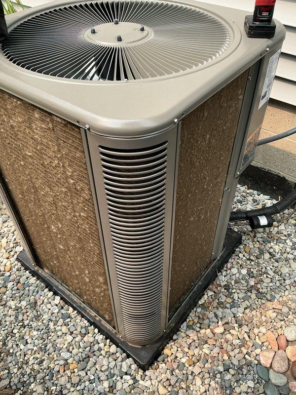 Completed comprehensive AC tune-up on Lennox air conditioning system as part of scheduled maintenance appointment. Performed standard inspection of outdoor condenser unit, verified proper operation of fan assembly and airflow through louver vents, and addressed customer inquiry regarding airflow optimization for cooling performance. System confirmed operating properly with all components functioning within normal parameters.