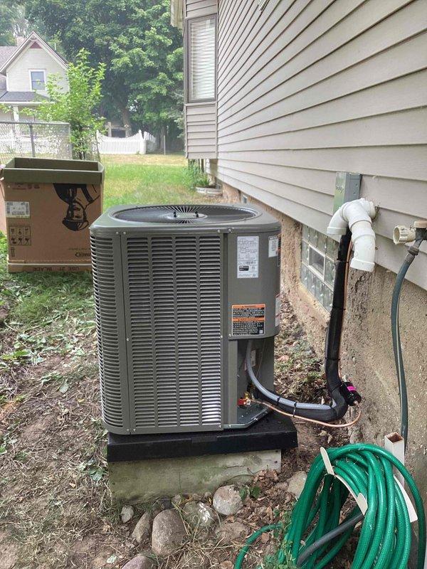 Completed installation of 3-ton air conditioning system with evaporator coil at rear exterior location. Unit was set on concrete pad with proper refrigerant line connections, electrical conduit run, and PVC condensate drain installed per manufacturer specifications. System was reconnected, tested, and left operational with all required permits processed.
