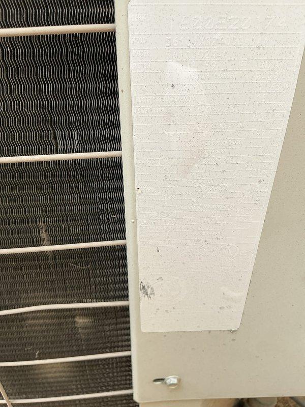 # HVAC Service Completed

Responded to no-cooling complaint on 10+ year-old residential air conditioning system. Unit was not reaching set point temperature of 72°F, remaining at 77°F throughout the house. Customer reported temporary resolution after power cycling the unit and noted similar issue two years prior that required capacitor replacement.

Upon arrival, performed visual inspection of outdoor condenser unit. Unit is installed on concrete pad with standard refrigerant line set and electrical disconnect present. Examined condenser coil condition and observed typical wear consistent with age of equipment. Documented equipment condition with photos showing condenser unit exterior, coil fins, and cabinet components.

Conducted diagnostic evaluation to determine root cause of cooling deficiency. Given the system's age (10+ years), history of capacitor failure, and intermittent nature of the problem, performed electrical component testing including capacitor values, contactor operati