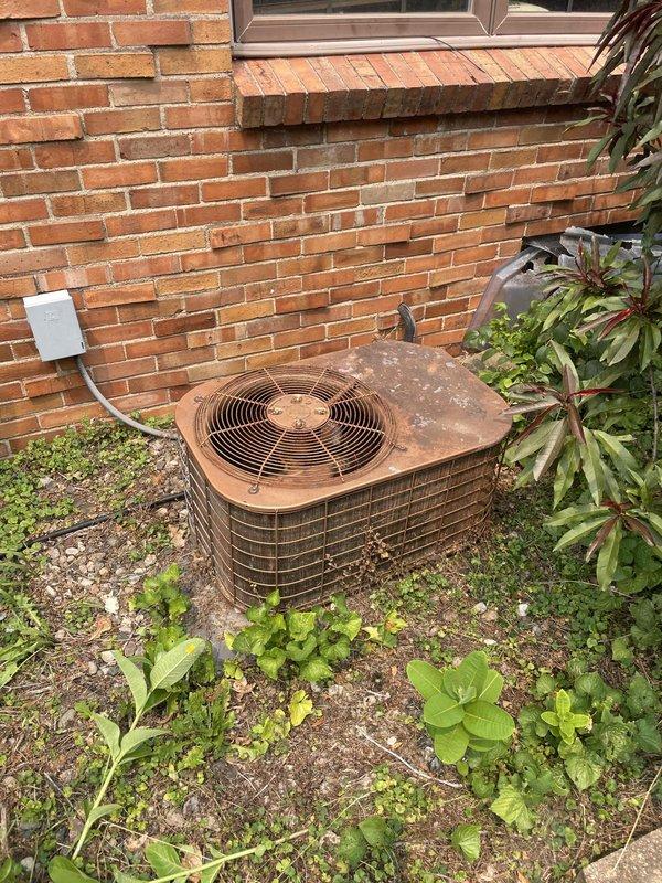 Provided estimate for complete air conditioning system replacement. Existing 30-year-old outdoor condenser unit shows extensive rust, corrosion, and weathering with compromised functionality. Basement-located air handling equipment includes integrated Space-Gard air filtration system. Assessed aging HVAC infrastructure and documented current equipment condition through comprehensive site photography to prepare replacement recommendations.