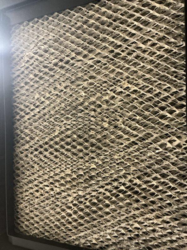 Completed routine Air Care Maintenance inspection of cooling system. Replaced air filter and inspected evaporative cooler pad, which showed moderate mineral buildup and discoloration but remained serviceable. Addressed customer inquiry regarding elevated January energy bill and provided explanation of seasonal usage patterns.