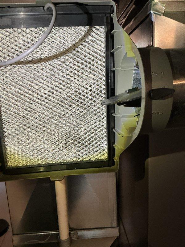 Completed annual cooling maintenance on residential HVAC system. Inspected air filter showing moderate dust accumulation along bottom edge, checked furnace unit and associated ductwork components for proper operation, and verified all mechanical systems in basement installation were functioning within normal parameters.