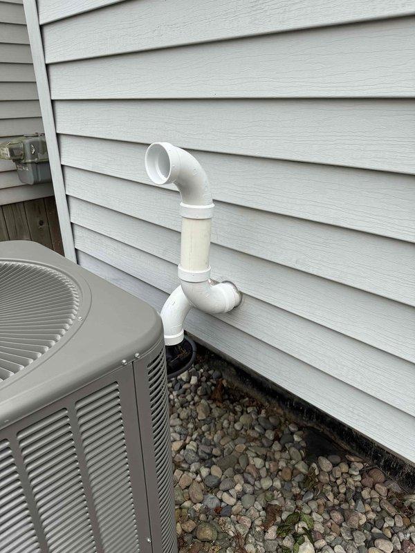 Completed full HVAC system installation including 110,000 BTU gas furnace, 3.5-ton air conditioning unit, evaporator coil, and humidifier. Installed outdoor condensing unit on gravel pad with proper condensate drainage piping routed up exterior wall. Reconnected all electrical connections and established proper refrigerant lines between indoor and outdoor equipment. System tested and operational upon completion.