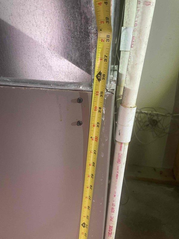 Performed estimate for air conditioning system replacement in basement location. Existing unit is non-operational and outdated. Documented current HVAC equipment configuration including air handler, ductwork system, and condensate drainage lines. Assessed installation area showing metal supply and return ducts with significant dust accumulation, PVC condensate piping, and electrical connections. Measured existing equipment dimensions and clearances for replacement unit specifications. Provided comprehensive estimate for complete A/C system replacement with applicable service credit toward new installation.