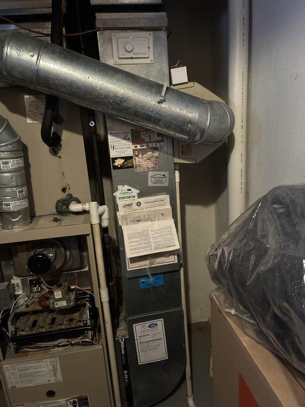 Conducted comprehensive assessment of 16-year-old HVAC system with depleted refrigerant levels in air conditioning unit. Evaluated existing furnace and AC equipment in basement utility area, documented current system configuration including ductwork and electrical connections, and provided full system replacement estimate for both heating and cooling components due to age and refrigerant loss in existing unit.