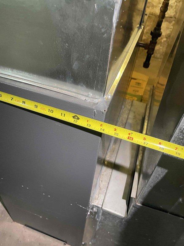 Conducted on-site evaluation for new central air conditioning system installation in home with no existing AC equipment. Assessed existing ductwork dimensions and mechanical space to determine equipment sizing requirements and installation feasibility. Documented measurements of air handler clearances and refrigerant line connection points to prepare comprehensive installation estimate for complete AC system.