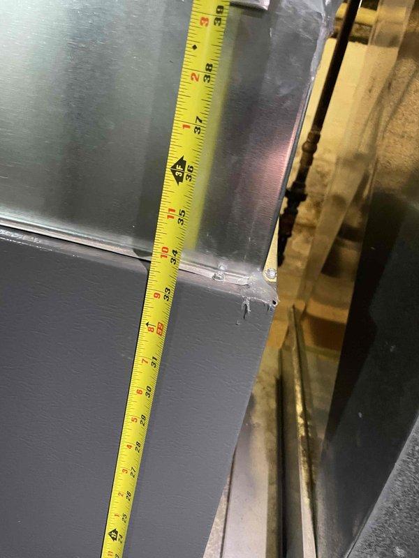 Conducted on-site evaluation for new central air conditioning system installation in home with no existing AC equipment. Assessed existing ductwork dimensions and mechanical space to determine equipment sizing requirements and installation feasibility. Documented measurements of air handler clearances and refrigerant line connection points to prepare comprehensive installation estimate for complete AC system.